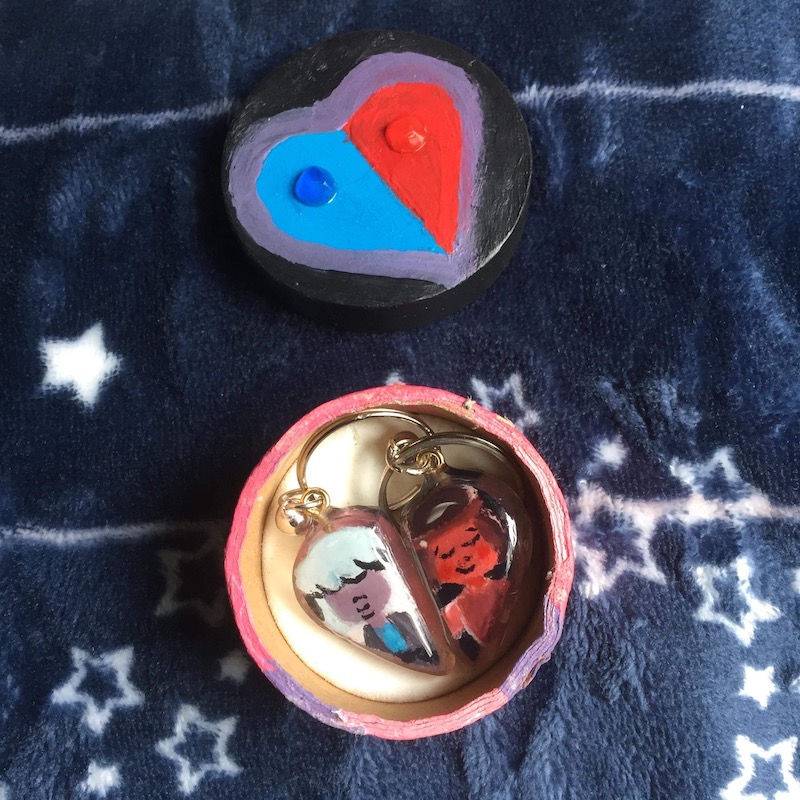 Keychains of Ruby and Saphire from Steven Universe in a decorated box